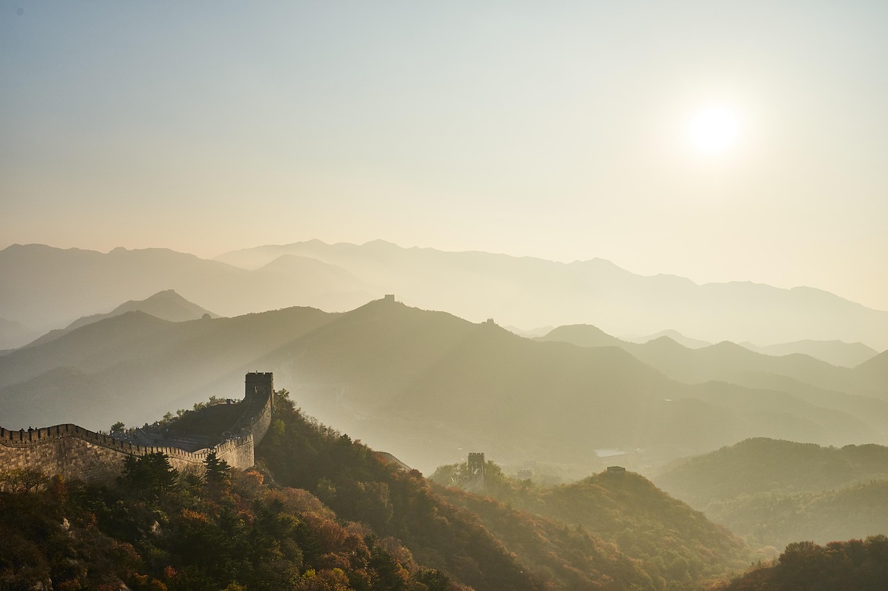 Sunrise over the Great Wall of China at Mutianyu with misty mountains in the background