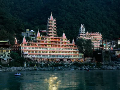 A lone pilgrim walking barefoot on an ancient stone path toward a distant temple silhouette at dawn