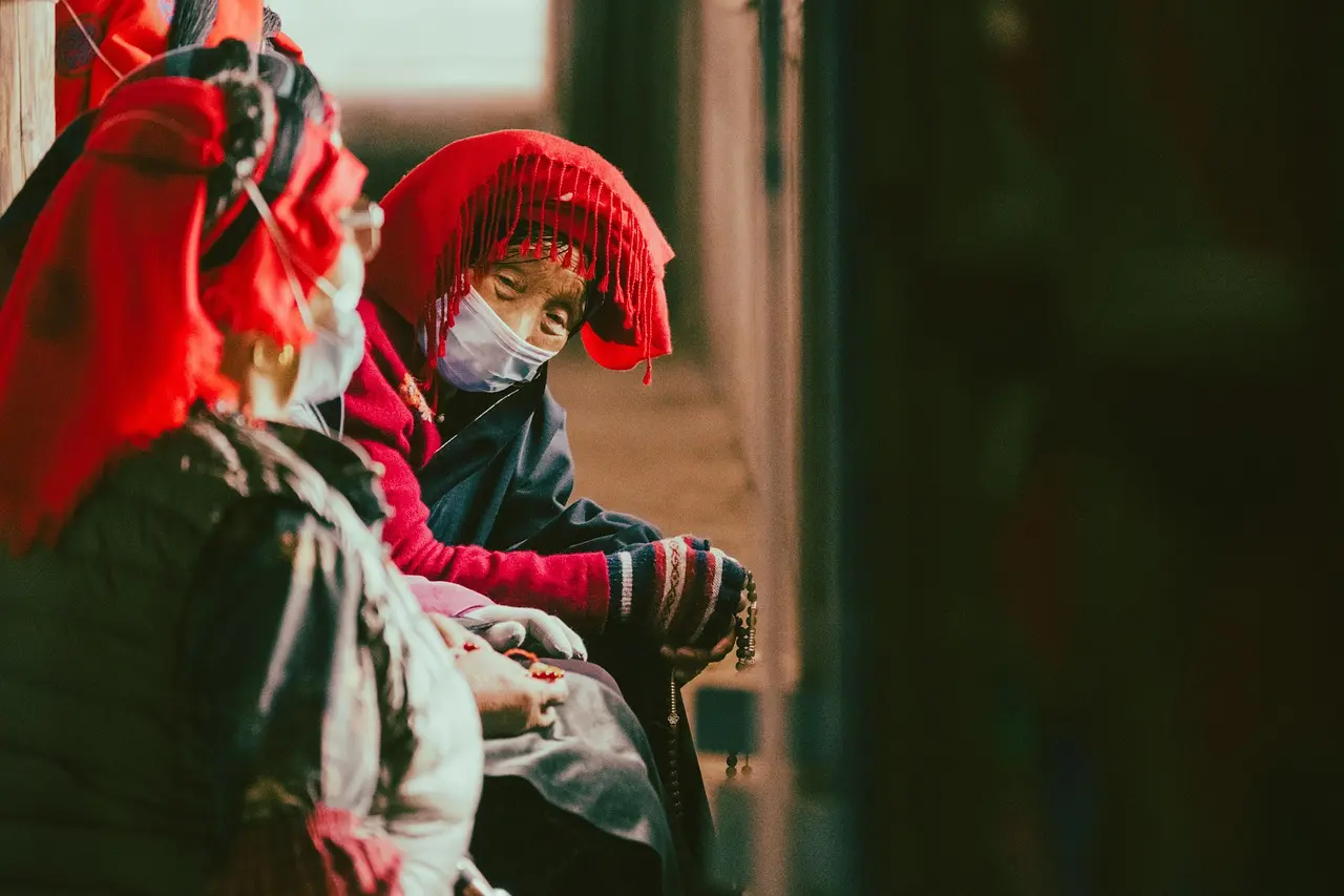 Monks performing sacred Cham dance at Hemis Monastery — a profound cultural experience through local festivals and folk performances in Ladakh, India Tibetan Buddhist monks in colorful robes and ceremonial masks performing Cham dance in monastery courtyard