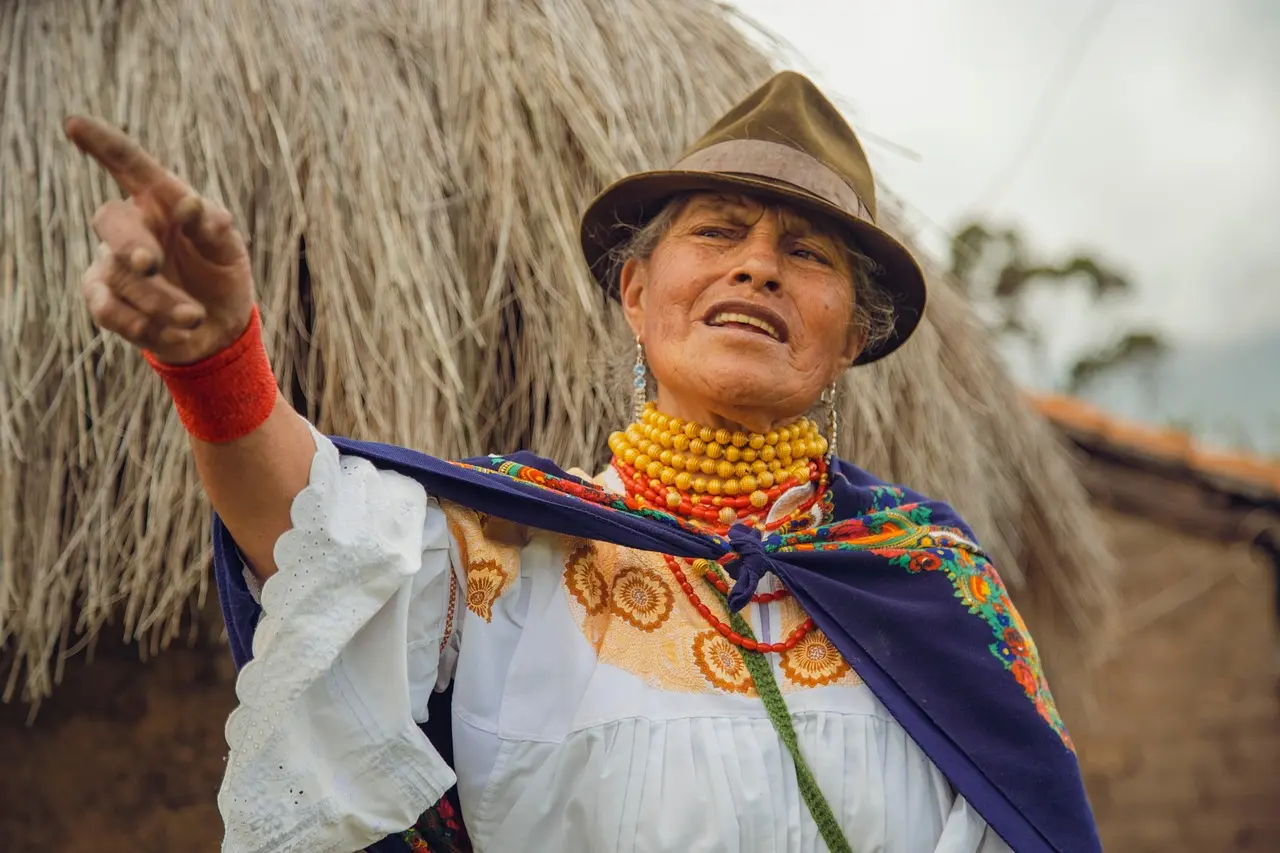 Sámi joiker performing at Riddu Riđđu Festival — a contemporary, courageous cultural experience through local festivals and folk performances Sámi woman performing traditional joik with reindeer-hide drum in Arctic landscape